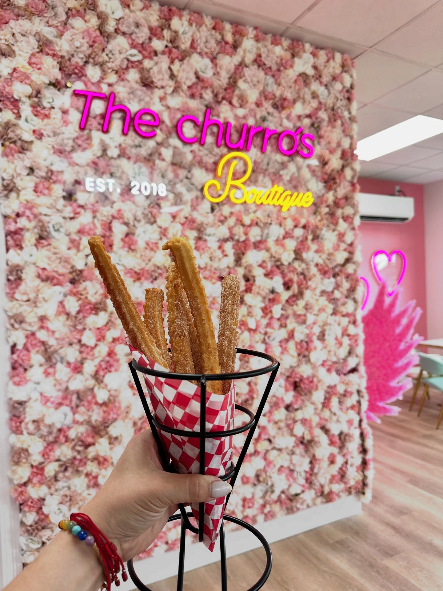 Fresh churros with dipping sauce at The Churro's Boutique